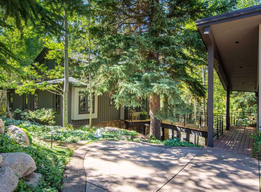Nestled amidst lush greenery, this stunning property offers a serene retreat.