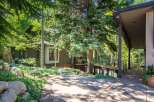 Nestled amidst lush greenery, this stunning property offers a serene retreat.