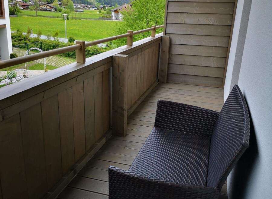 Enjoy breathtaking mountain views from this charming balcony.