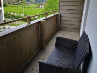 Enjoy breathtaking mountain views from this charming balcony.