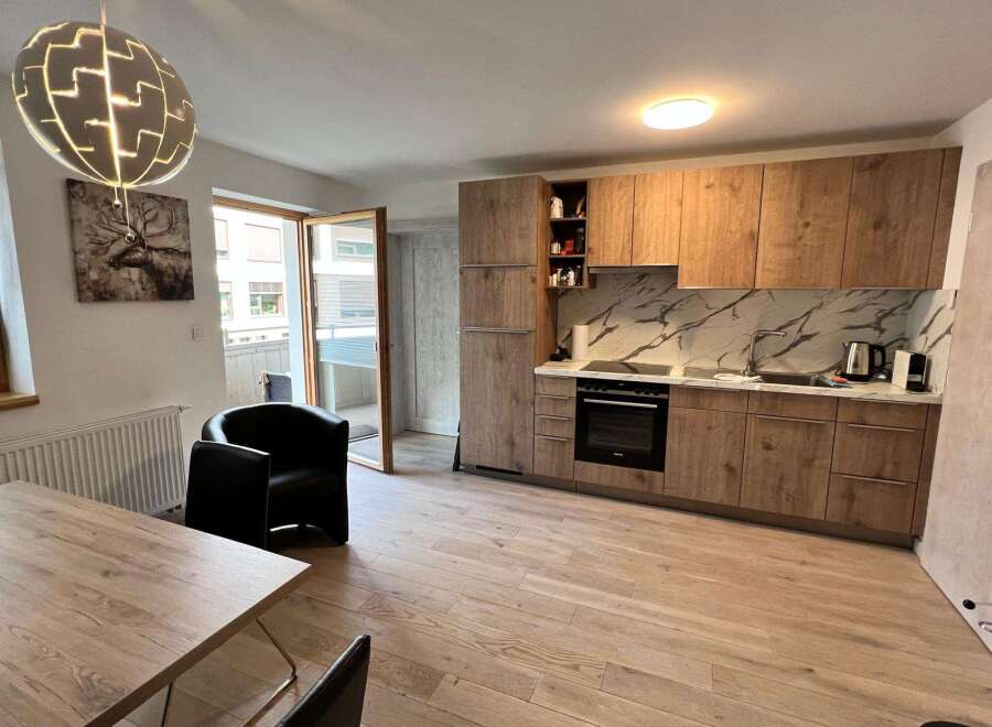 Discover modern living in this stylish property! This home features a beautifully designed kitchen with sleek cabinetry and a stunning marble backsplash.