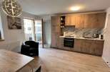 Discover modern living in this stylish property! This home features a beautifully designed kitchen with sleek cabinetry and a stunning marble backsplash.