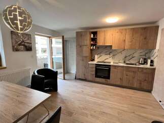 Discover modern living in this stylish property! This home features a beautifully designed kitchen with sleek cabinetry and a stunning marble backsplash.
