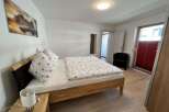 This inviting bedroom features a comfortable bed, perfect for a relaxing stay.