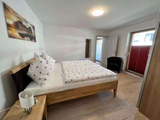 This inviting bedroom features a comfortable bed, perfect for a relaxing stay.