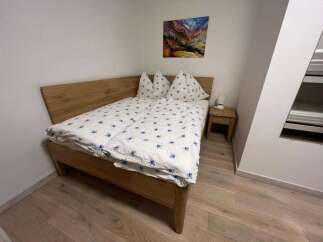 This cozy bedroom features a comfortable bed with a stylish duvet cover and pillows.