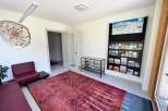 Step into this inviting space, perfect for welcoming guests or creating a comfortable waiting area.
