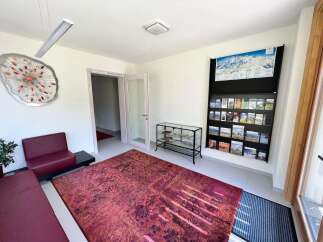 Step into this inviting space, perfect for welcoming guests or creating a comfortable waiting area.