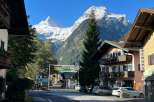 Discover the charm of this picturesque village nestled amidst stunning mountain scenery.