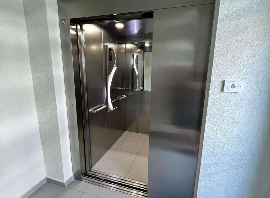 Step into luxury with this modern elevator, a seamless blend of style and functionality.