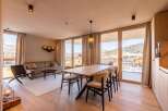 Experience luxury living in this stunning property, featuring a spacious dining area perfect for entertaining.