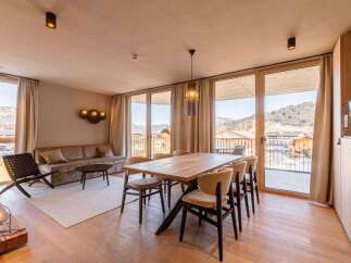Experience luxury living in this stunning property, featuring a spacious dining area perfect for entertaining.