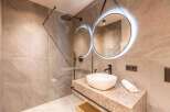 Experience luxury in this modern bathroom, featuring a sleek design and high-end finishes.