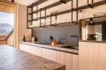 Experience modern luxury in this stunning kitchen, featuring sleek cabinetry and a sophisticated design.