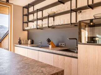 Experience modern luxury in this stunning kitchen, featuring sleek cabinetry and a sophisticated design.
