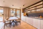 Experience luxury living in this stunning property, featuring a modern kitchen with sleek cabinetry and ample storage.