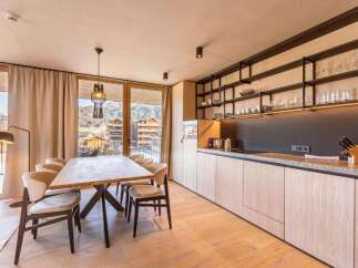 Experience luxury living in this stunning property, featuring a modern kitchen with sleek cabinetry and ample storage.