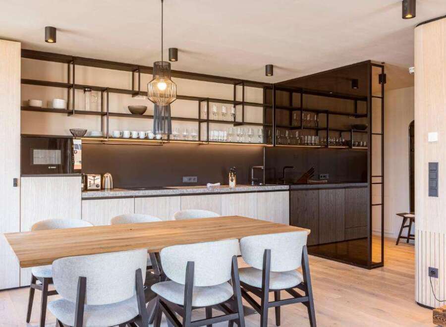 Experience modern luxury in this stunning kitchen and dining area.