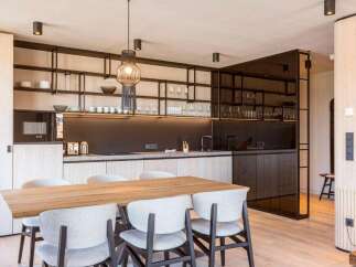 Experience modern luxury in this stunning kitchen and dining area.