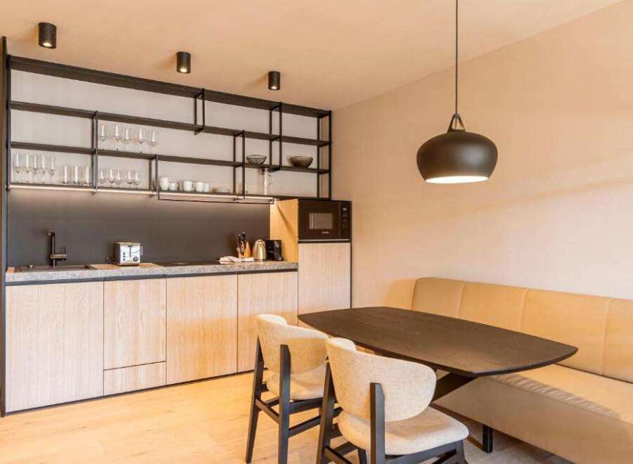 Discover modern living in this stylish property! Featuring a sleek kitchen with ample storage and a cozy dining area, perfect for entertaining.