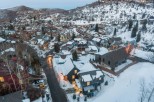 Nestled in a snow-covered mountainside, this charming home offers breathtaking views and a peaceful atmosphere.