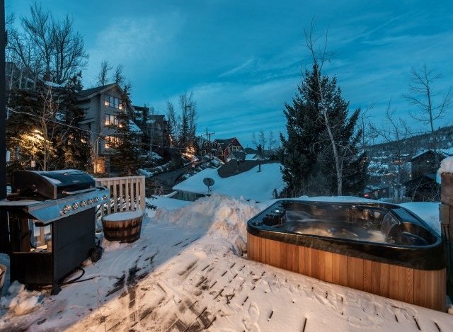 Luxury mountain getaway with private hot tub and deck.