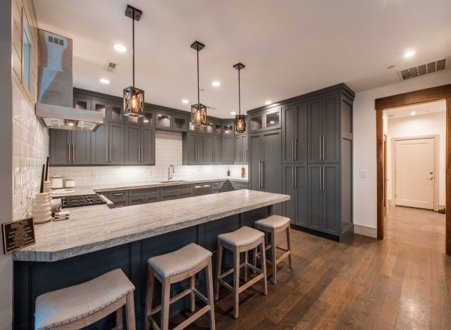 This stunning kitchen boasts a spacious island with seating, perfect for casual dining and entertaining.