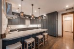 This stunning kitchen boasts a spacious island with seating, perfect for casual dining and entertaining.