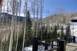 Stunning mountain views from this deck, nestled amongst tall aspen trees.