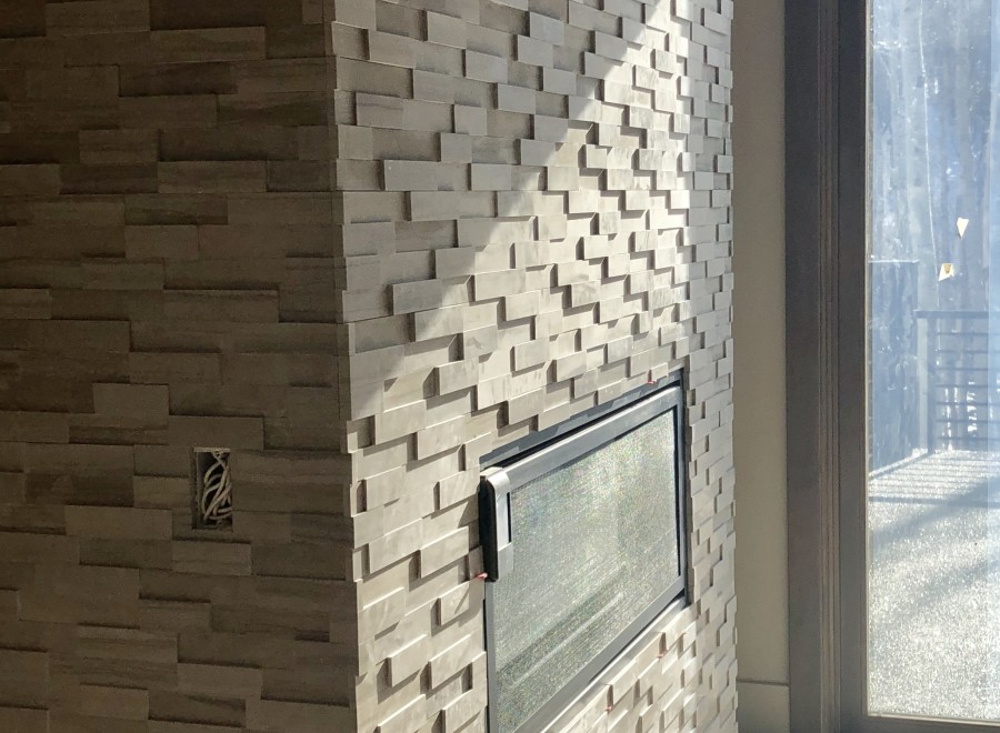 Modern fireplace with a unique stacked stone design.