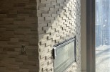 Modern fireplace with a unique stacked stone design.