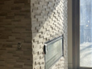 Modern fireplace with a unique stacked stone design.