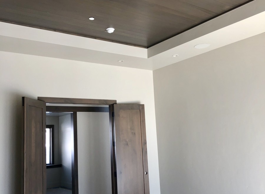 This stunning property boasts a beautiful coffered ceiling with dark wood beams, adding a touch of elegance to the space.