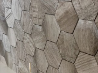 Stunning hexagon wood-look tiles create a unique and modern wall design.