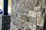 This stunning property boasts a rustic-chic exterior, featuring a beautiful blend of natural stone and wood.