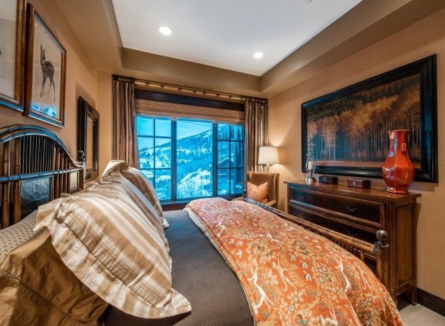 Luxurious bedroom with stunning mountain views.
