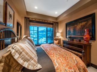 Luxurious bedroom with stunning mountain views.