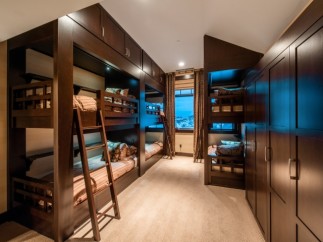 This stunning property boasts a spacious bunk room, perfect for families or groups.