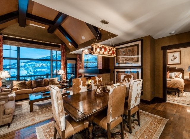 This luxurious mountain condo boasts stunning views, a spacious open floor plan, and a gourmet kitchen.