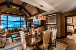 This luxurious mountain condo boasts stunning views, a spacious open floor plan, and a gourmet kitchen.