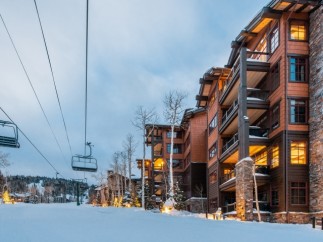 Luxury ski-in/ski-out condos offer breathtaking mountain views and easy access to slopes.
