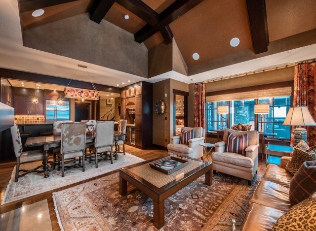 This luxurious living space boasts a spacious open floor plan, seamlessly connecting the dining area and living room.
