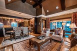 This luxurious living space boasts a spacious open floor plan, seamlessly connecting the dining area and living room.