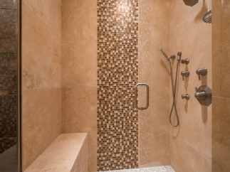 Luxury shower with built-in seat and multiple shower heads.