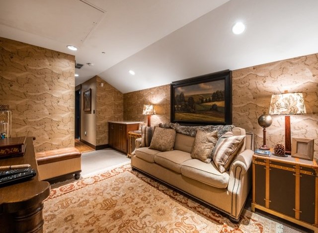 Cozy attic retreat with a plush sofa, perfect for relaxing evenings.