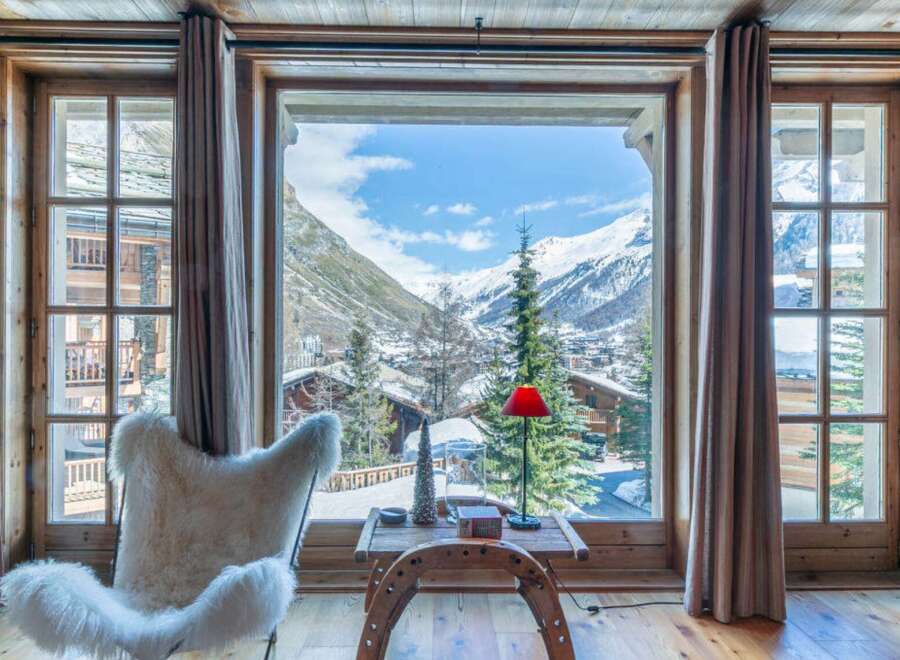 Experience the ultimate in alpine luxury with this stunning property, offering breathtaking views of snow-capped mountains.