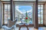 Experience the ultimate in alpine luxury with this stunning property, offering breathtaking views of snow-capped mountains.