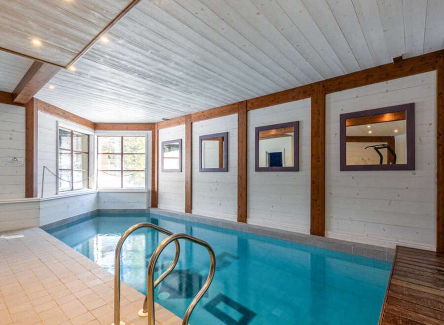 This stunning indoor pool offers a luxurious retreat within the home.