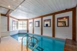 This stunning indoor pool offers a luxurious retreat within the home.