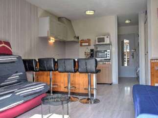Discover this charming property featuring a well-equipped kitchen with modern appliances and a cozy living area.